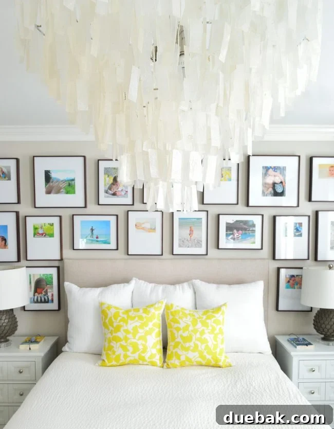 Light Up Your Sleep: Bedroom Refresh with a Chandelier and New Bed 16 Well-styled master bedroom with a gallery wall, cozy bedding, and a playful dog.