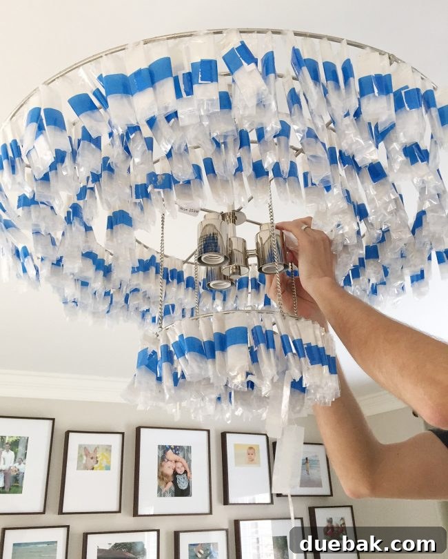 Light Up Your Sleep: Bedroom Refresh with a Chandelier and New Bed 7 Close-up of numerous capiz shell strands meticulously wrapped for shipping.