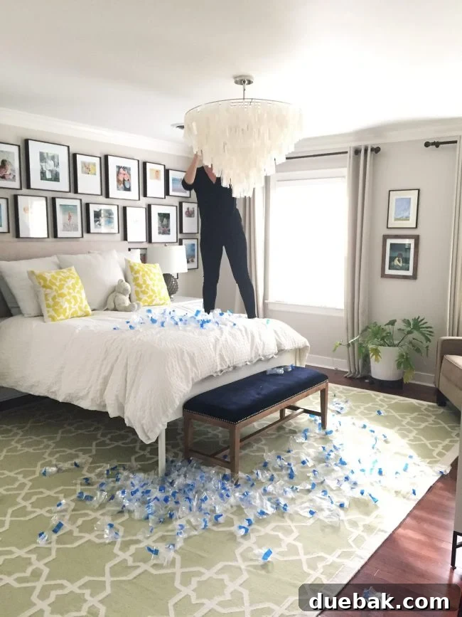 Light Up Your Sleep: Bedroom Refresh with a Chandelier and New Bed 9 A stunning capiz chandelier illuminates a stylish bedroom, showcasing its beauty and improved lighting.