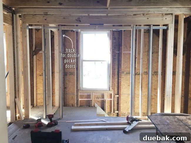 Pocket door tracks installed in master bedroom area