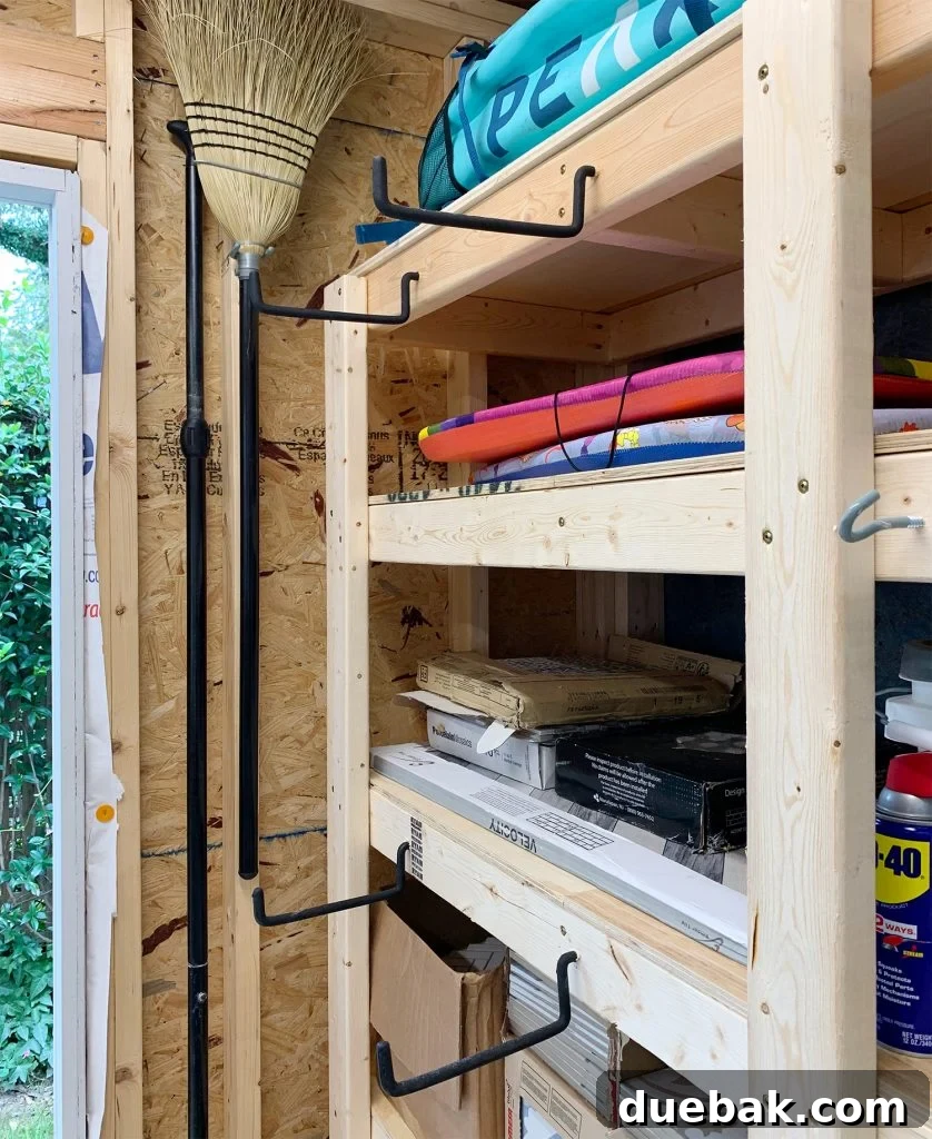 Large rubber hanging hooks on front of heavy duty shed shelves for versatile storage