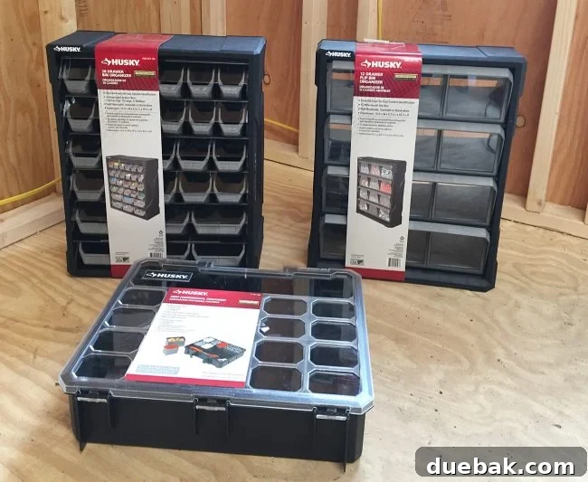 Various small part organizers laid out in a shed for sorting