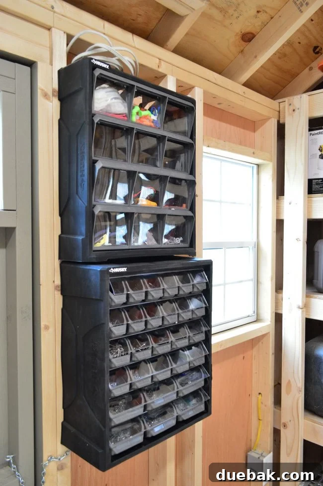 Wall-mounted small part organizers with clear compartments for nails and screws