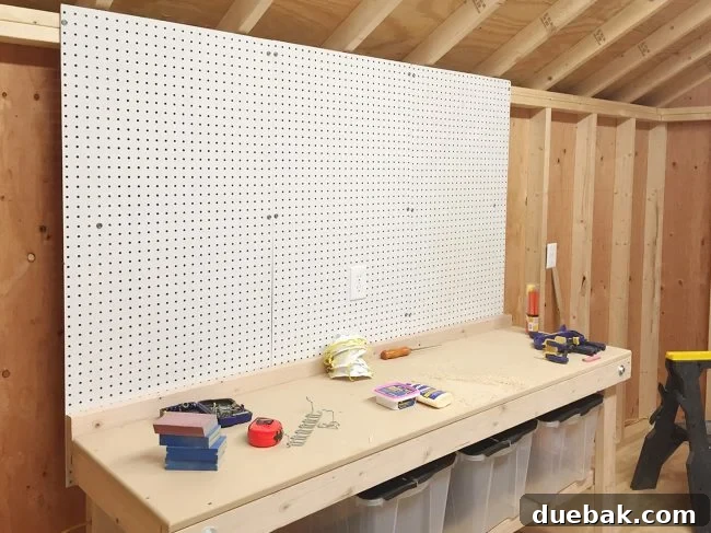 Pegboard with various tools neatly hung
