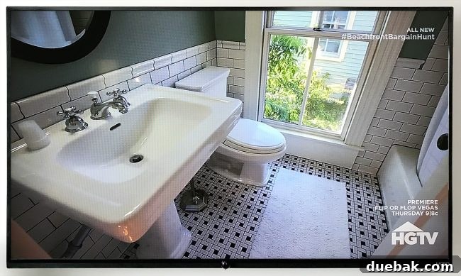 Our Beach House Steals the HGTV Spotlight 12 Bathroom window of the HGTV featured house, with our beach house's bathroom window visible outside