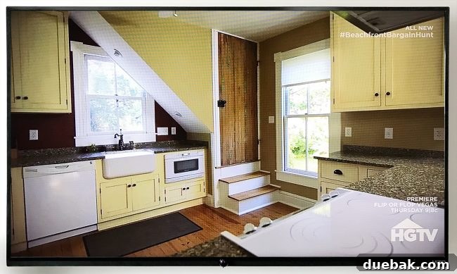 Our Beach House Steals the HGTV Spotlight 9 Rear view of the HGTV featured kitchen, showing how the back door was replaced with a window for more counter space