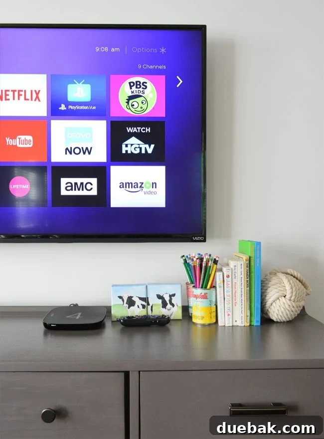 Unlock 1000 Dollars in Savings With This Home Habit 2 A family relaxing and watching TV in a modern living room, symbolizing cable cutting and streaming entertainment.