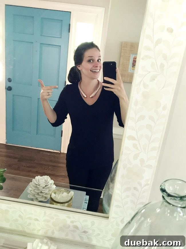 Unlock 1000 Dollars in Savings With This Home Habit 4 A woman smiling and wearing sleek wireless Bluetooth headphones, demonstrating a fashionable and functional tech accessory.