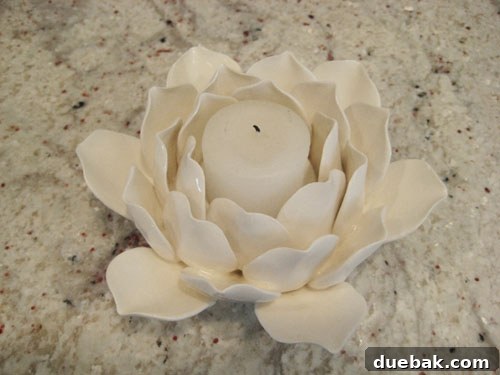 Delicate white ceramic votive candle holder