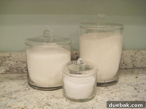 Clear glass kitchen storage jars filled with white ingredients