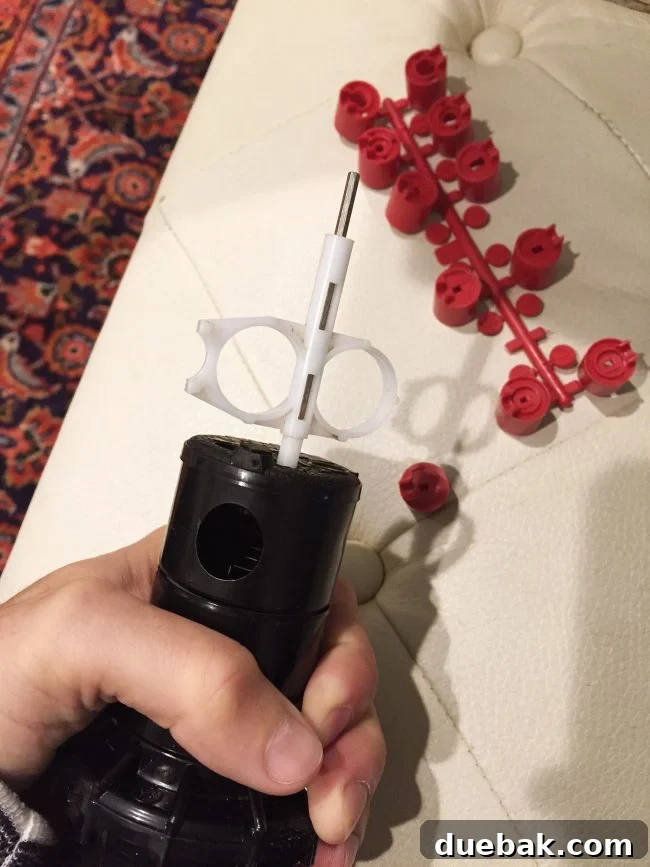 Process of adding a red nozzle to a Hunter PHP sprinkler head using a specialized key