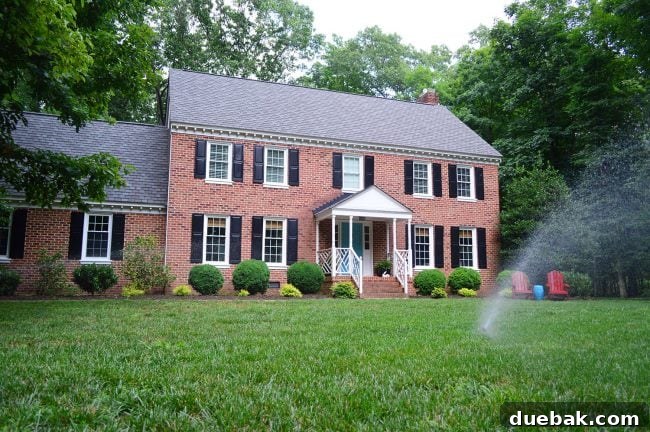 A beautifully maintained front yard showcasing a newly installed irrigation system for automated watering