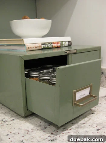 Open Drawer of Vintage Card Catalog with Organized Spice Jars