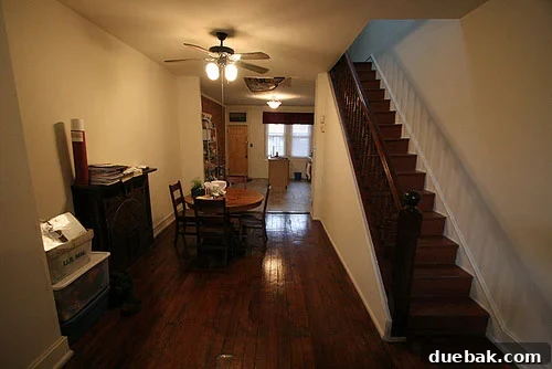 A beautifully renovated living space with warm lighting and exposed brick accents