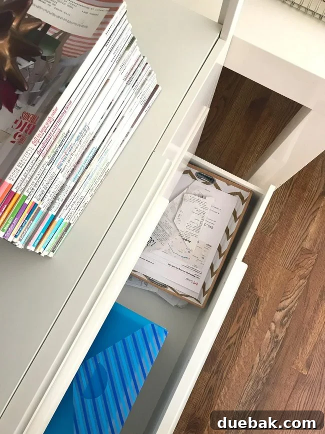 Mastering Paper Clutter for Good 5 Drawer filled with receipts and invoices for organization.