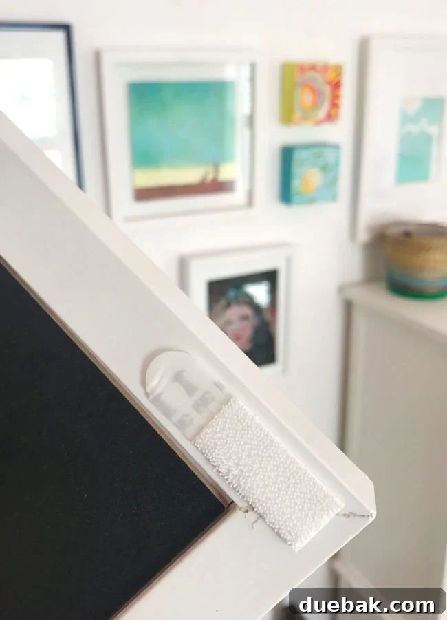 Mastering Paper Clutter for Good 6 Frame on a gallery wall secured with Velcro strips.