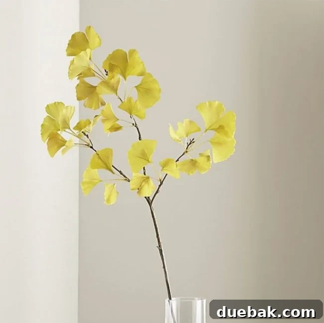 Labor Day Home Refresh: Furniture and Decor Savings 11 Crate & Barrel ginkgo stems and magnolia garland for elegant seasonal decor.