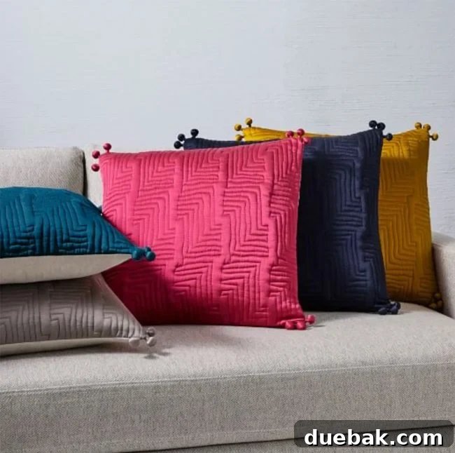 Labor Day Home Refresh: Furniture and Decor Savings 4 Assortment of colorful West Elm pillow covers, perfect for a quick room refresh.