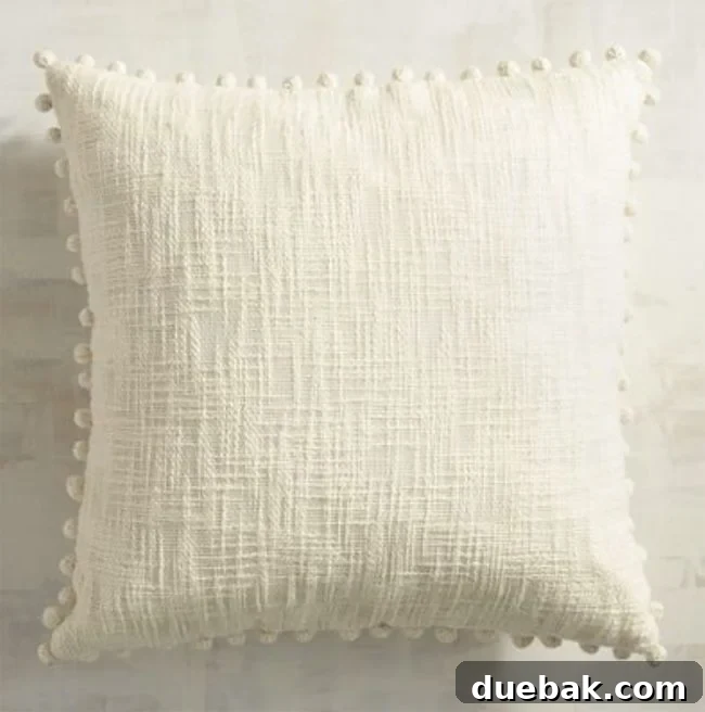 Labor Day Home Refresh: Furniture and Decor Savings 8 Pier 1 pom pom pillows in various colors, adding texture and fun.