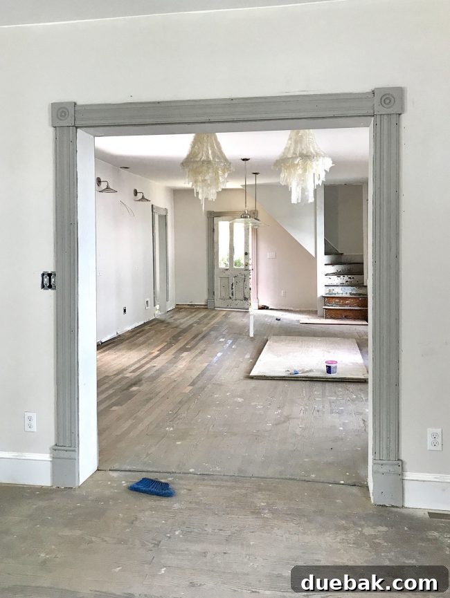 Beach house dining area with capiz pendants hung, still wrapped in plastic