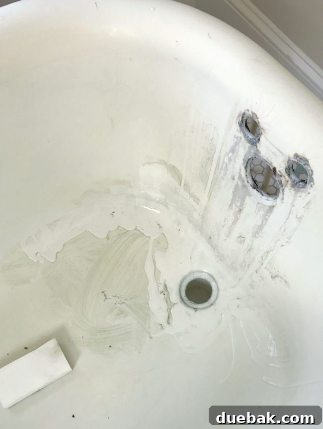 Soft cleanser and magic eraser in a clawfoot tub, demonstrating intense cleaning effort