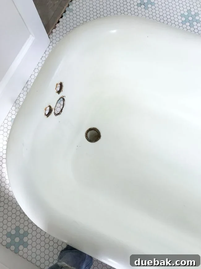 Cleaned white inside of the refinished clawfoot tub, ready for new fixtures