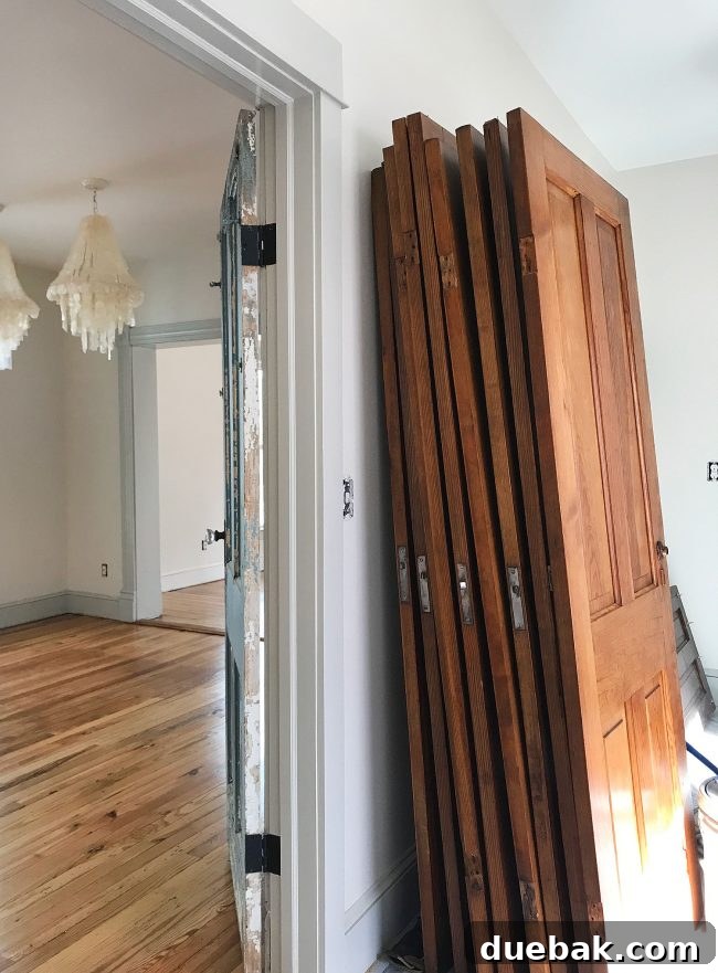 Refinished heart pine doors complementing the newly sealed pine floors