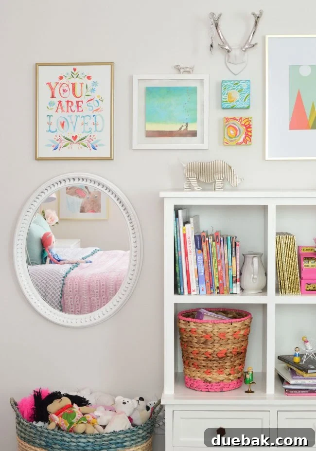 Girls bedroom art gallery wall with mixed gold and silver frames