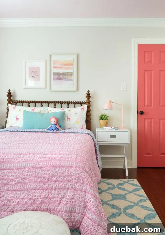 Girls bedroom with updated pink patterned bedding and new wall color