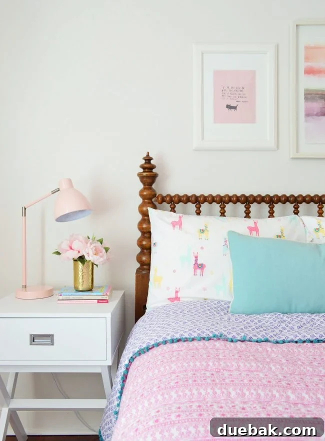 Girls bedroom with Target white nightstands and pink bedding featuring llama sheets