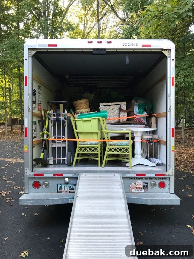 Coastal Comforts Await 4 U-Haul truck loaded with beach house furniture and boxes