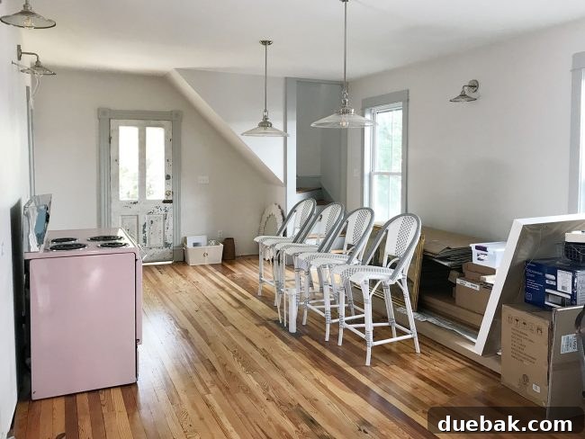 Coastal Comforts Await 6 Unfinished kitchen with pink stove installed