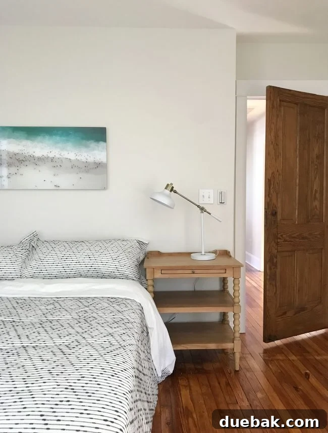 Glass mounted beach photo in bedroom