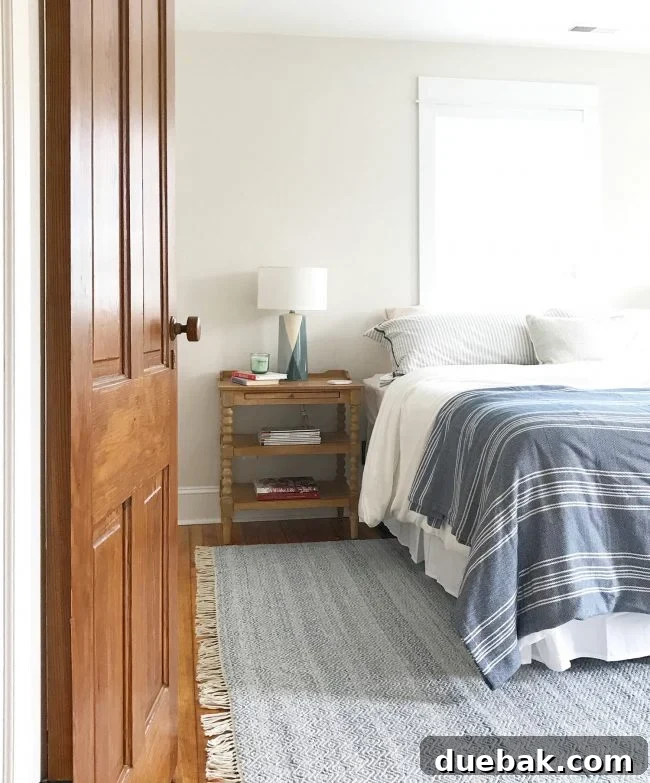 Front bedroom in beach house with new rug and side tables