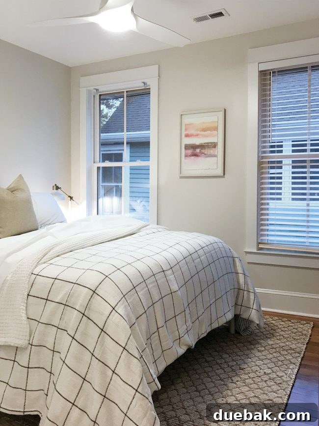 Guest bedroom in beach house with new sandy-colored rug