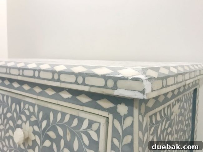 spackle fill to repair inlay tile that is missing or broken