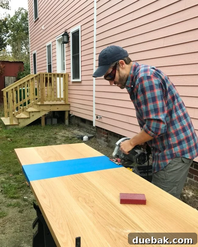 John wearing laser enhancing safety goggles while working with wood