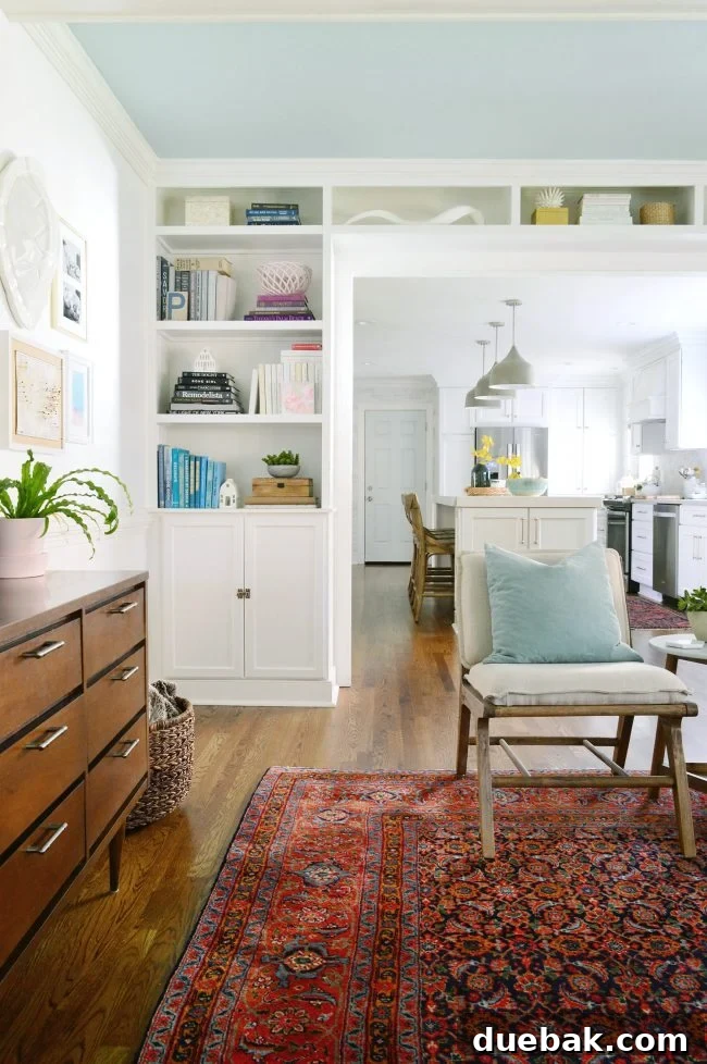 Living room with custom built-in bookshelves around a doorway
