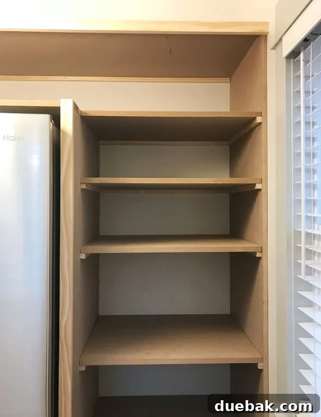 pantry shelves added on side of walk-in pantry