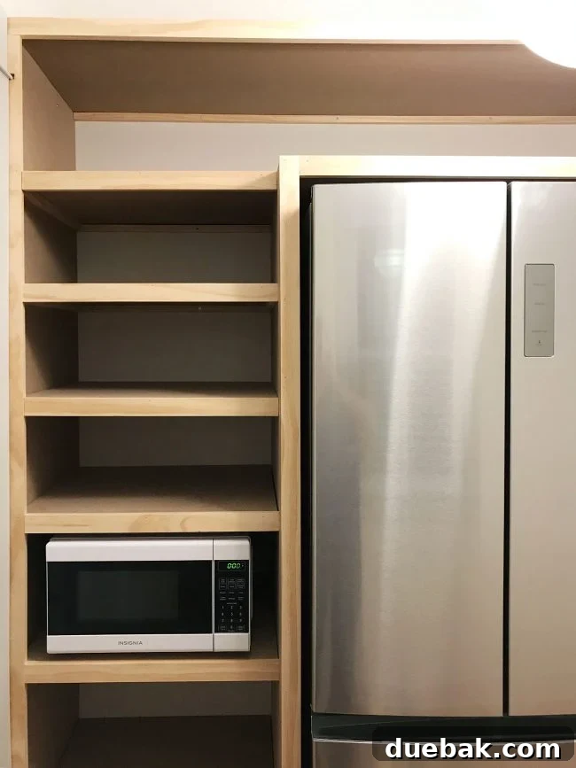 left side of built in pantry shelving with all face pieces installed