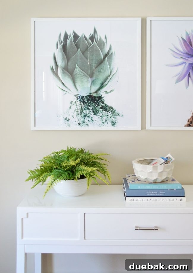 And Then Winter Took Our Water 6 A large, artificial fern in a decorative pot, used as a focal point to declutter a dining room console.