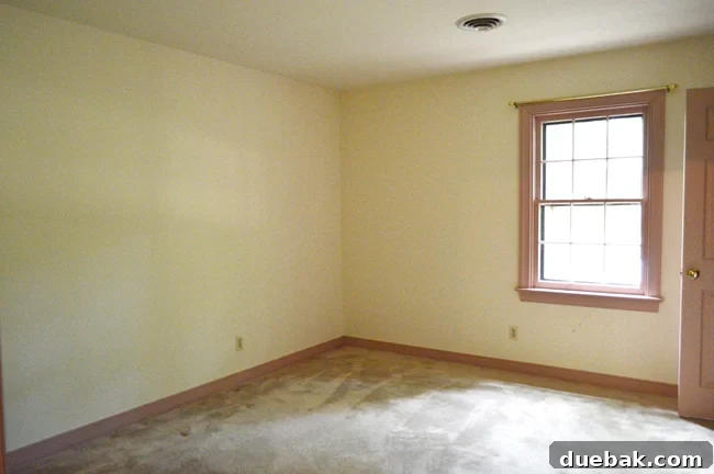 Transforming Our Son's Space 16 Boy's bedroom before renovation, with old carpet and pink trim