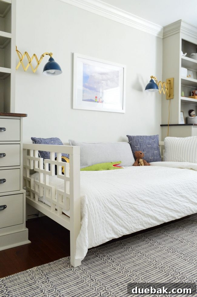 Transforming Our Son's Space 6 Close-up of brass and blue enamel sconce in boy's bedroom