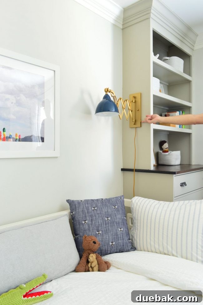 Transforming Our Son's Space 7 View showing plug-in sconce cord running along the baseboard