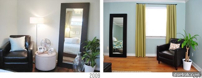 Early photo of a white Ikea planter in a bedroom, next to other furniture.