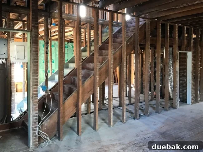 Duplex interior during demolition, showing open staircases