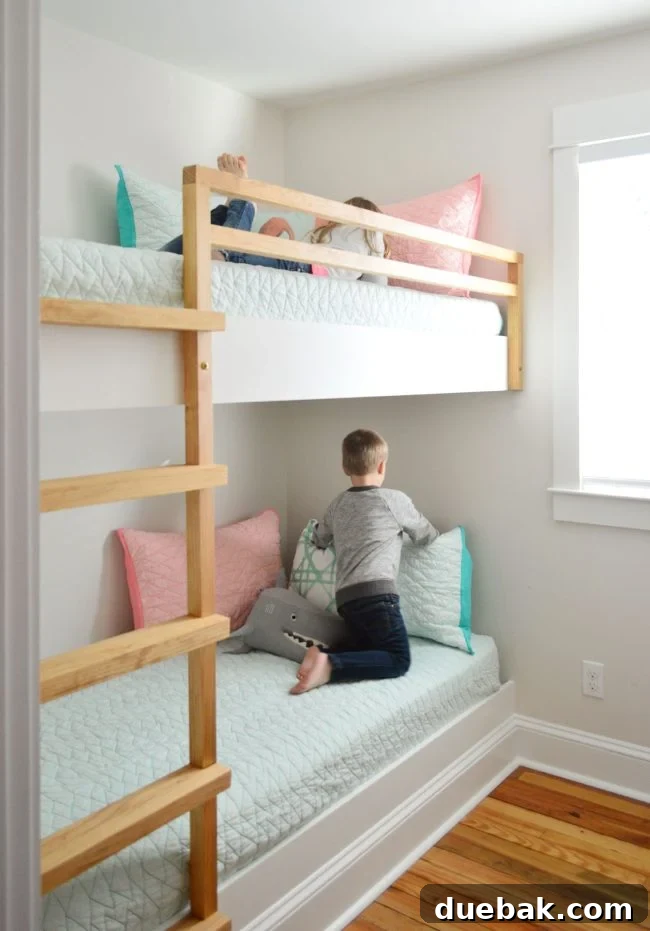 Constructing Bespoke Bunk Beds 2 Children happily playing and sleeping on their newly built custom bunk beds in a small, well-designed room.