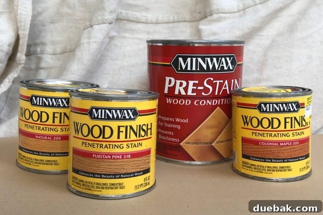 Constructing Bespoke Bunk Beds 29 An assortment of Minwax stain color test pots, showcasing the meticulous testing process to find the perfect wood tone.
