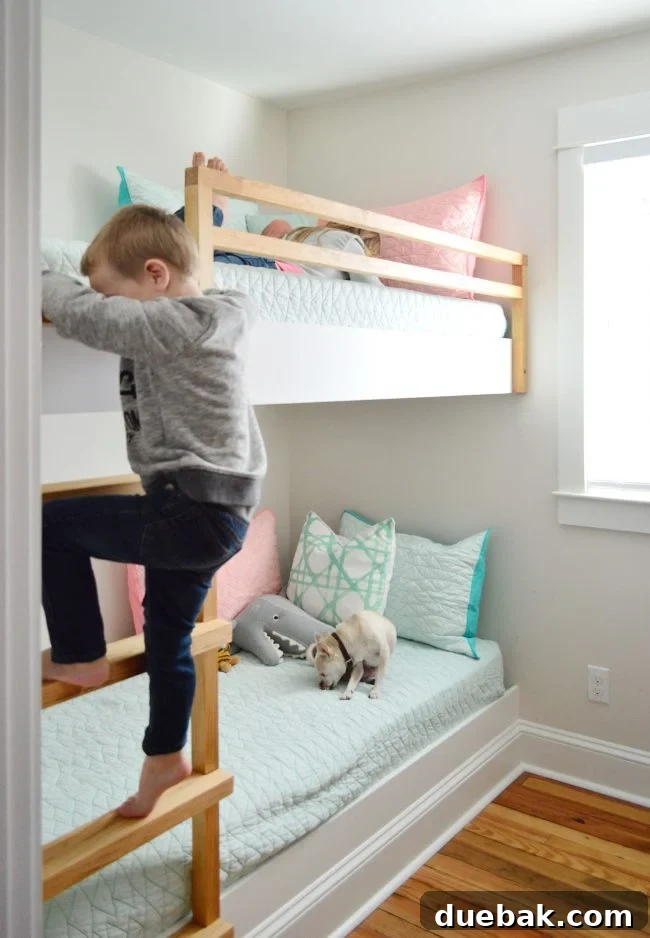 Constructing Bespoke Bunk Beds 31 A child joyfully climbing the stained wood ladder to the top bunk of the newly completed DIY built-in bunk beds.