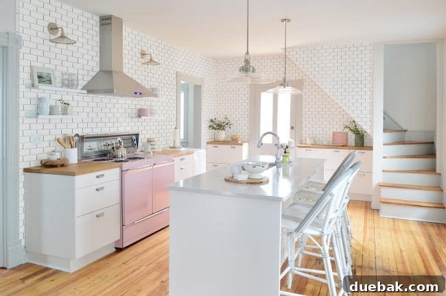 Kitchen mock-up with subway tile extending to the ceiling and also covering the base of the staircase bump-out